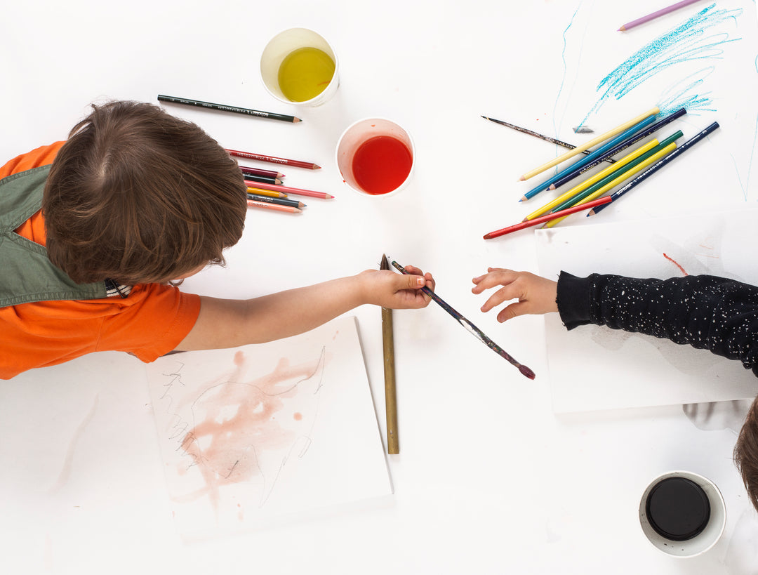 Blossom & Bloom Kids sensory play with kids painting with water color and coloring with pencil