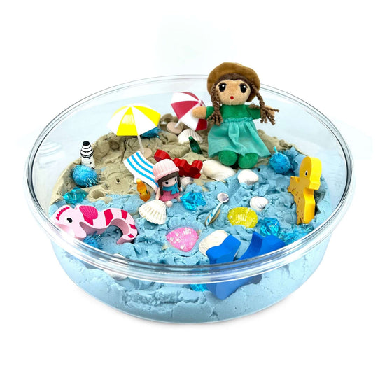 Beach Day Kinetic Sand Kit with Organic Cotton Beach Figure, Umbrellas, Beach Chairs, Bottles, Seashells, Wooden Sea creatures and more from Blossom & Bloom Kids - Beach Day, Ocean Theme Set with Kinetic Sand - Blossom & Bloom Kids
