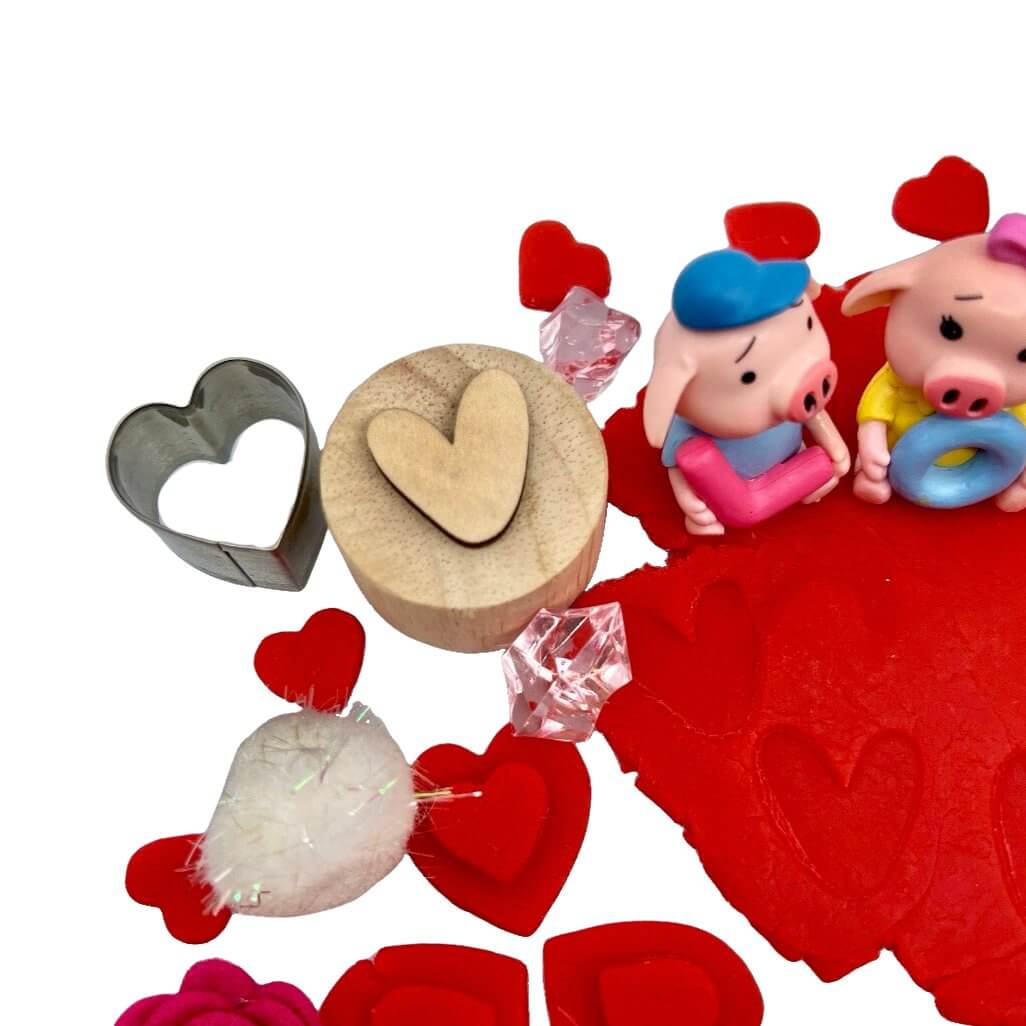 Heart shaped cutter, heart shaped stamp and red playdough with heart stamped included in All You Need Is Love Bloom Bag from Blossoms & Bloom Kids - All You Need Is L-O-V-E, Playdough Kit - Blossom & Bloom Kids