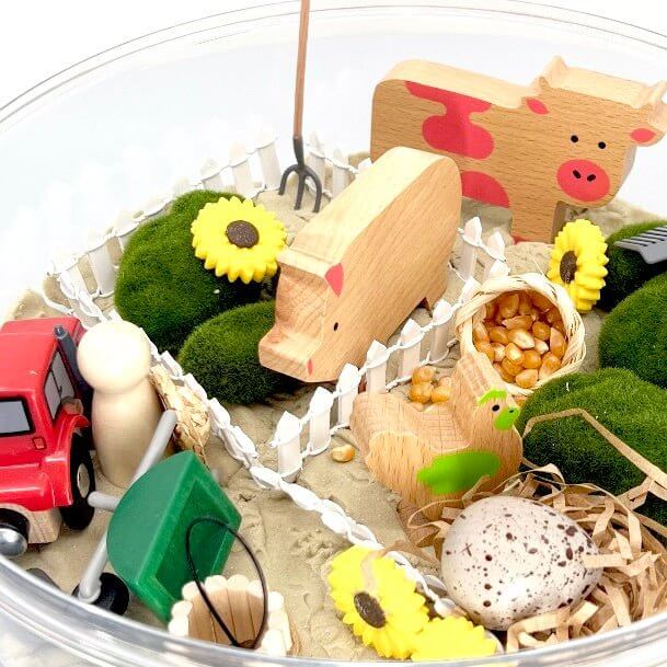 Barnyard Friends Sensory play kit with kinetic sand and wooden animal toys that support  Montessori learning from Blossom & Bloom Kids